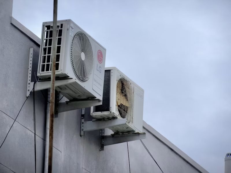 Modern air conditioner and heat pump unit on a home