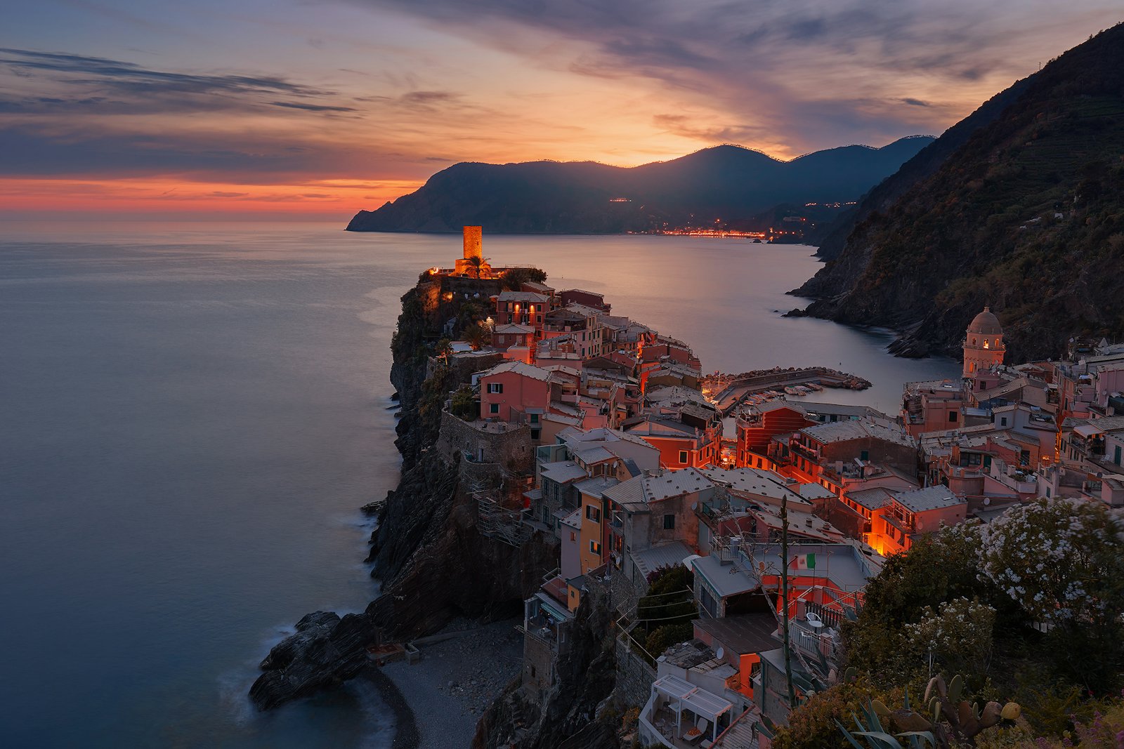 Pastel houses on the Italian shoreline at dusk